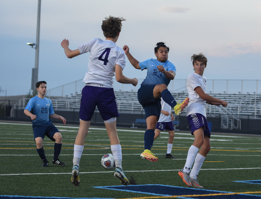 Riverdale Ridge's Josue Pina Lizama gets caught between Mountain View defenders Braydon Thompson and Jacob Berg (4) during a boys class 4A soccer game at Riverdale Ridge Sept. 22.
